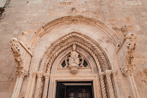 A statue of St Blaise holding a model of Dubrovnik. This is placed atop the Church of St Blaise in Luza Square.