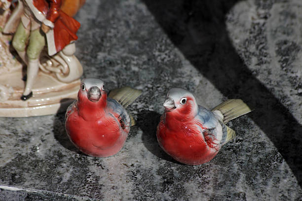 istock Two red and gray porcelain birds 2220391473