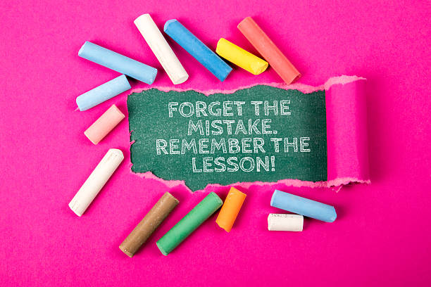 istock Inspirational Quote About Learning from Mistakes Surrounded by Colorful Chalk on Pink Background 2220391649