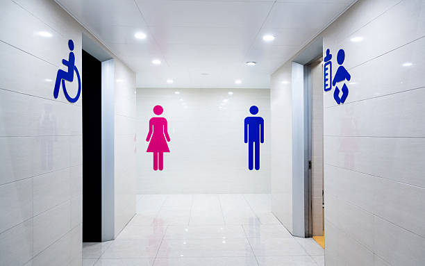 istock Toilet signs on ceramic tile wall 2220394335