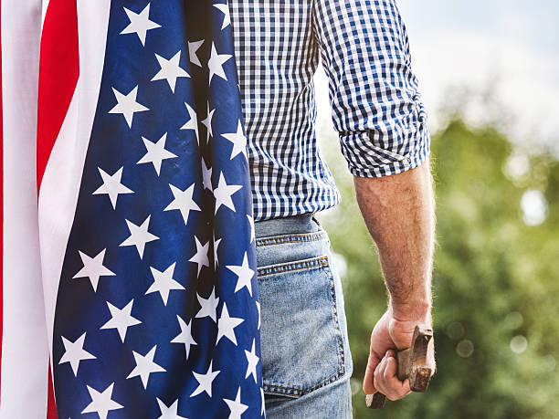 istock American flag, handsome man in work clothes 2220397856