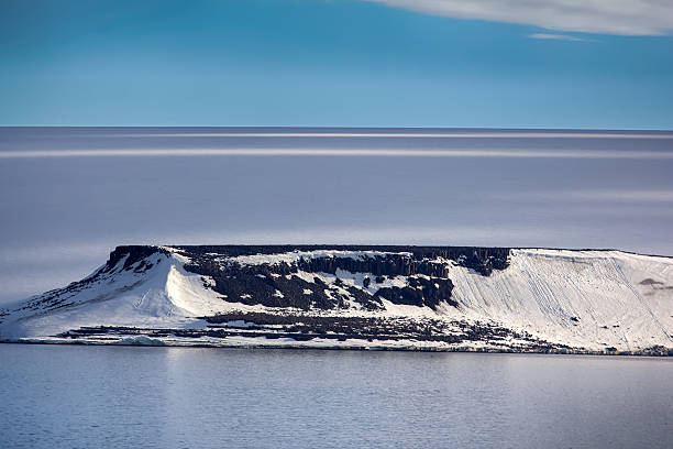 Islands along British channel. Glaciers, icefall, outlet glacier, snowfields, iceberg and rock outcrops. Franz Joseph Land