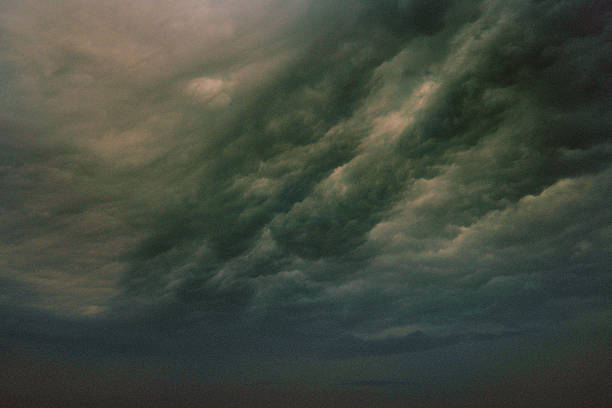 istock Dark Ominous Storm Clouds Gathering in the Evening Sky 2220403233