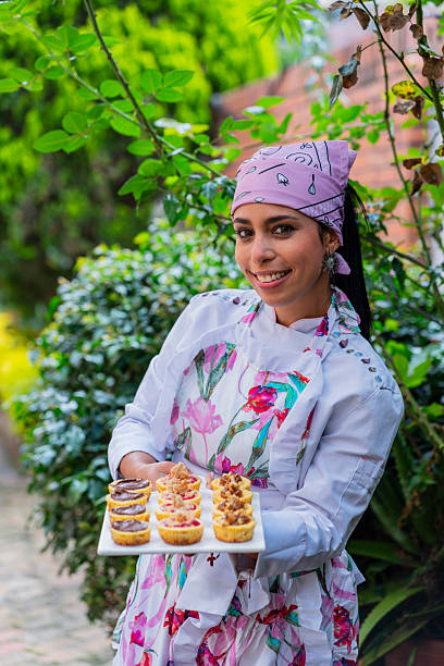 istock Female chef prepares food for a catering event 2220403241