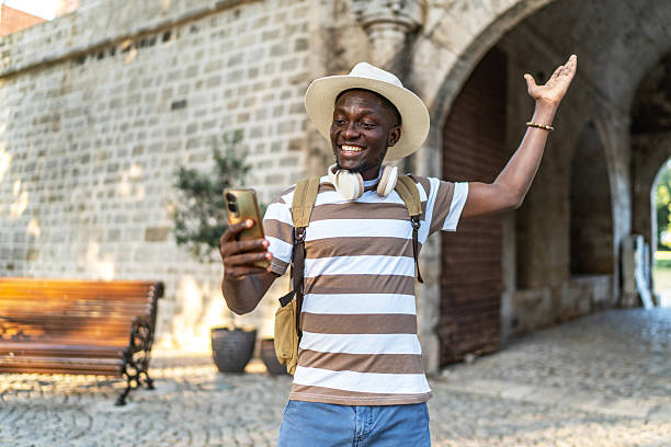 istock Happy tourist making video call while exploring ancient city 2220403566