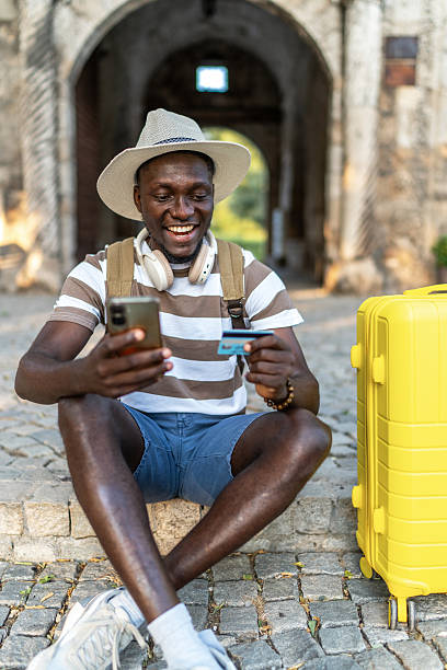 istock Tourist paying online with credit card while traveling 2220403676