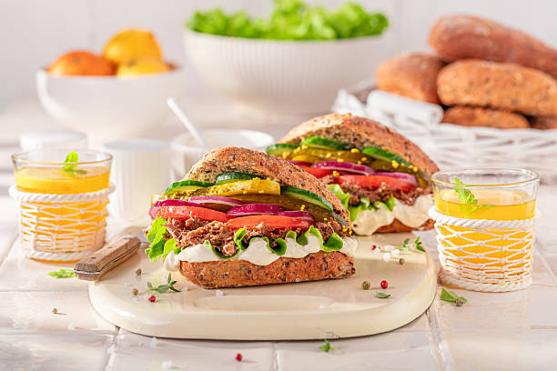 istock Tasty and homemade sandwich with pulled beef, gherkins and tomato. 2220404306