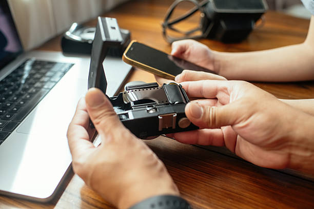 istock Man showing old retro camera to his son 2220405564