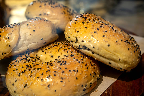 Sesame Seed Bagels on Wooden Platter