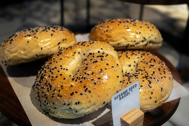 Sesame Seed Bagels on Wooden Platter