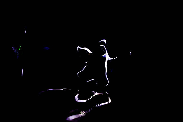 Silhouette of dancing man on black