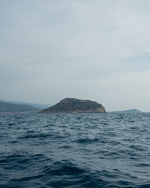 istock Isolated Island in the Open Sea 2220408378