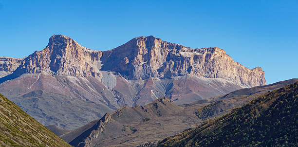 istock Majestic mountains tower over lush valley with dense forests and rolling hills, under clear blue sky, showcasing nature's grandeur and tranquility. Kabardino-Balkaria, Chegemsky district 2220409071