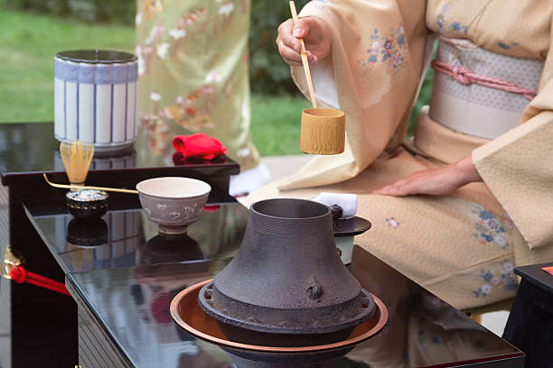 istock Woman in kimono performs Japanese tea ceremony 2220417498