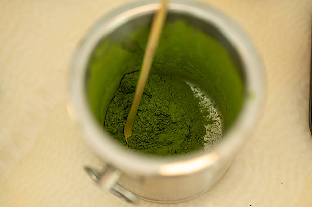 istock Matcha powder in a metal tin with a bamboo spoon 2220419790