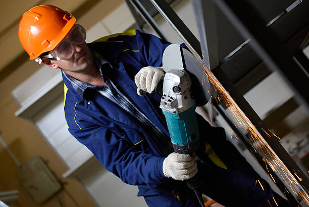 istock The worker is grinding the metal construction at the workplace 2220420141