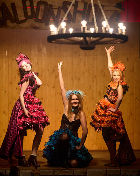 istock Tree young female dancers are performing a cancan dance on a stage 2220421301