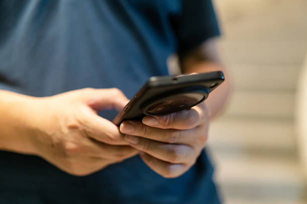 istock asian man using smart phone at night in city 2220423480