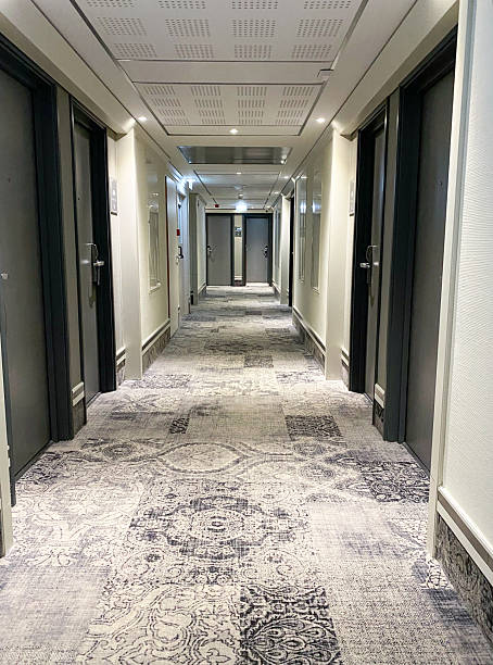 istock Long Illuminated Corridor In Hotel, Hotel Corridor Interior 2220428244