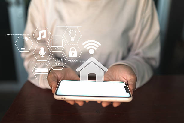 istock Use your phone to control home appliances. Smart home concept with connected technology icons. 2220429353
