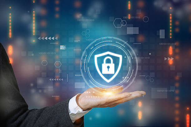 istock A businessperson holding a glowing padlock hologram, symbolizing advanced data protection solutions. 2220429503