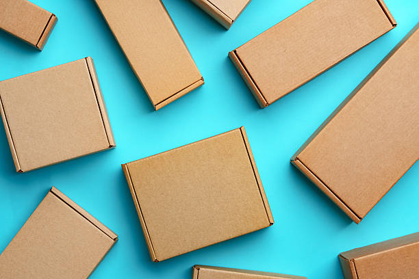 istock A collection of cardboard boxes arranged on a bright blue surface 2220430027