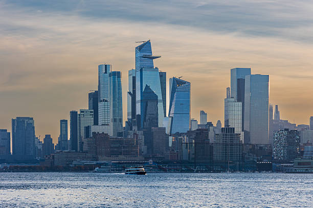 istock Ferry Crossing Hudson River at Dawn with Hudson Yards Skyline 2220430574