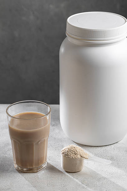 istock Protein shake. Chocolate flavored protein powder, dietary supplement. 2220431674