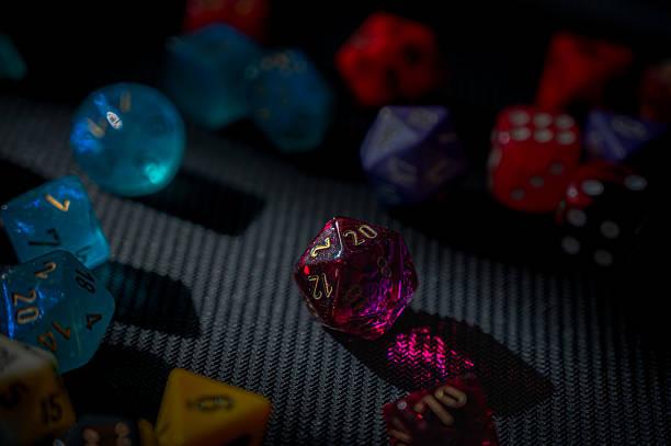 istock Glowing Magenta 20-sided Dice for Tabletop Role Playing Games 2220435046