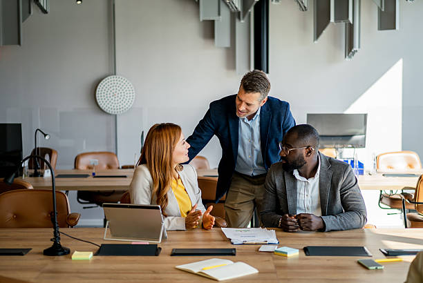 istock Business team discussing strategy in modern office 2220437519