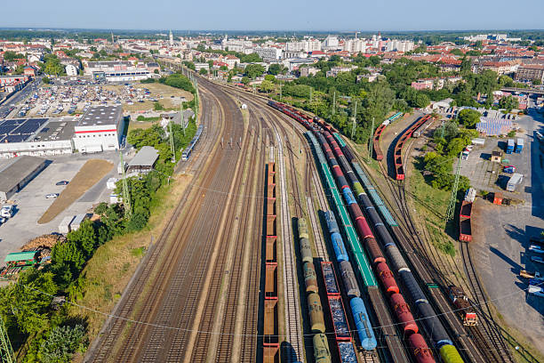 istock Urban freight train yard with colorful cargo wagons 2220437900