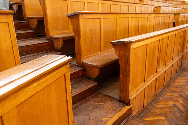 istock Rows of Wooden Benches in Auditorium 2220439774