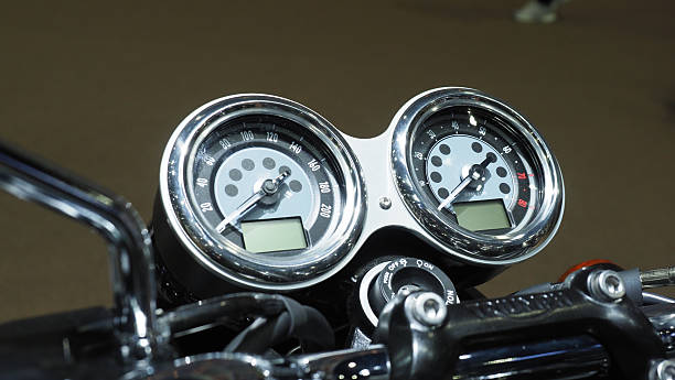 A motorcycle retro dashboard featuring dual analog gauges.A speedometer and tachometer.