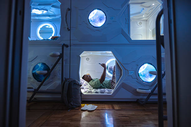 Man relaxing in a futuristic capsule pod with minimalist design