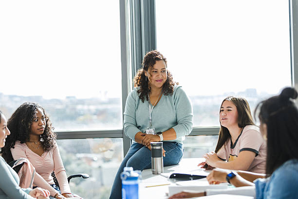 istock Group therapy session with diverse women, mental health support 2220444515