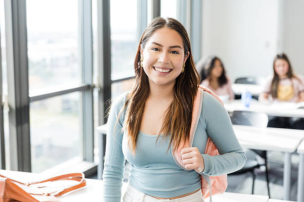istock Confident young Latina woman smiling in a classroom 2220444538