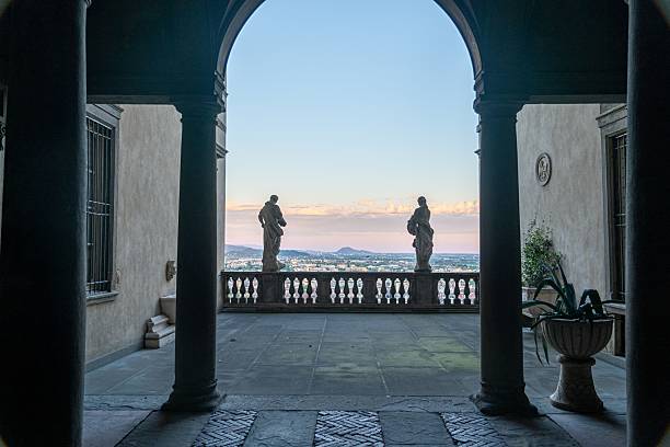 istock Archway View with Statues and Cityscape 2220446062