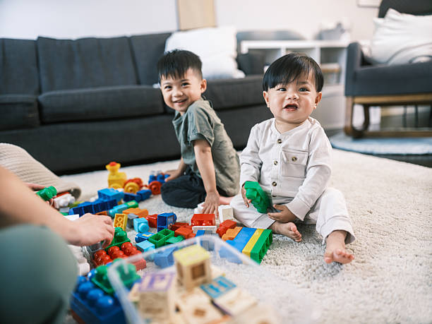 istock Young Korean Father at Home playing with 2 toddler sons 2220446152