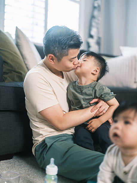 istock Young Korean Father at Home playing with 2 toddler sons 2220446632