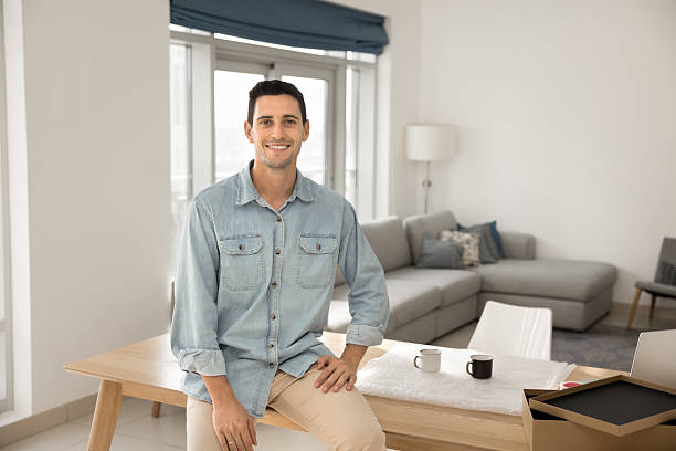 istock Happy young man web store owner posing at home office 2220446903