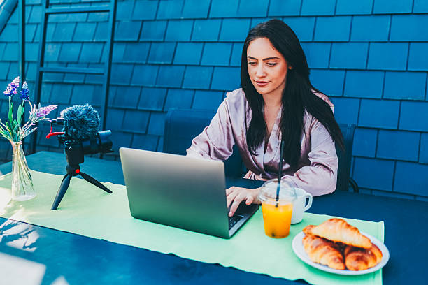 istock Influencer work and video content creation on a sunny terrace. 2220450774
