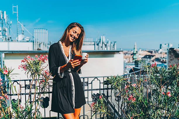 istock Summer rooftop relaxation with coffee and smartphone 2220450856