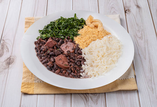 istock Typical brazilian feijoada with rice, pepper, farofa, kale and cracklings 2220452822