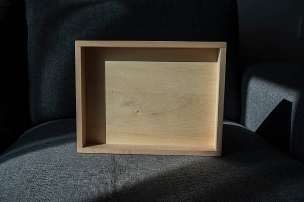 Sunlight shining on wooden box on sofa