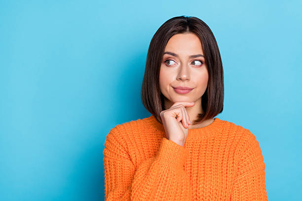 istock Portrait of attractive cheery girl making decision copy blank space place solution isolated over bright blue color background 2220459862