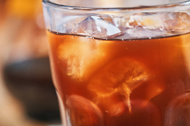 Preparing Iced Coffee Americano Served in a Glass