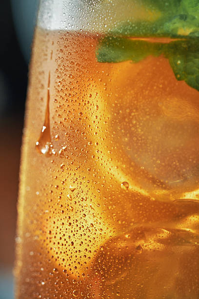 Peach Iced Tea Served with Lemon and Mint in a Glass