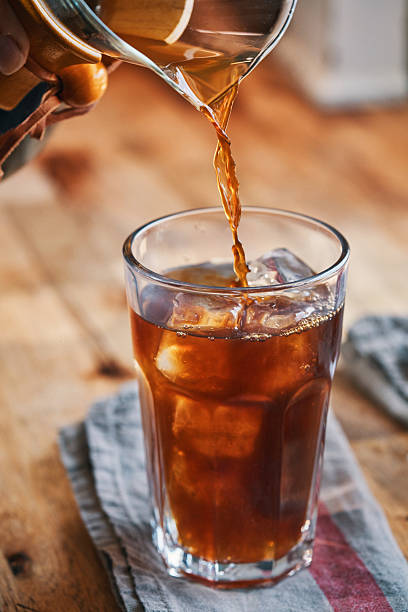Preparing Iced Coffee Americano Served in a Glass