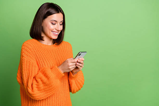 istock Profile side view portrait of attractive cheerful girl using device social network copy space isolated over bright green color background 2220461326