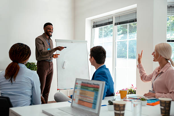 istock A young man gives a presentation to his colleagues 2220462257